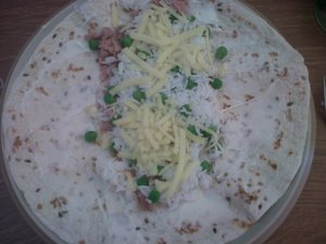 Wholegrain Wrap with tuna, cheese, garlic mayo, rice and peas.
